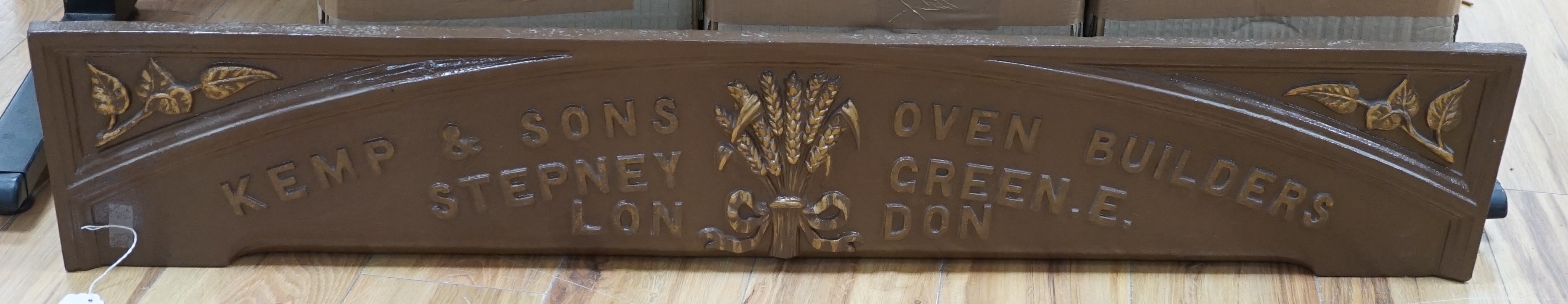 A Kemp & sons, oven builders, Stepney Green, London, cast iron advertising standing panel, 118 cms wide